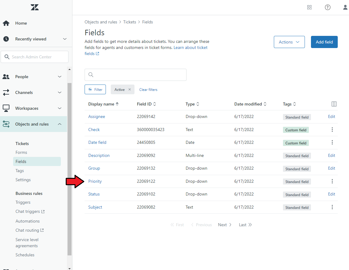 Zendesk For WHMCS: Zendesk Admin Center ticket Fields list with an arrow pointing at the Priority field